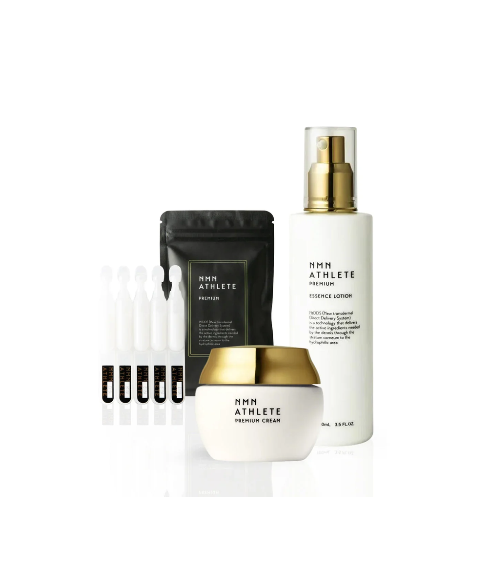Zestaw NMN ATHLETE Premium: Essence Lotion, krem do twarzy i ampułki na białym tle.